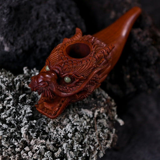Exquisite wood smoking pipe with a dragon theme, perfect for collectors and enthusiasts alike.