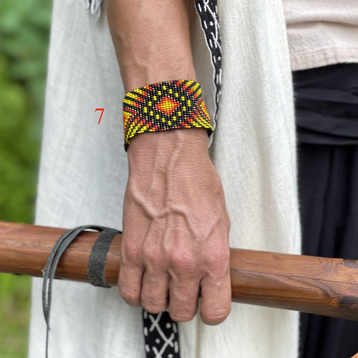 Handwoven bead loom bracelets with Ayahuasca-inspired tribal patterns, combining shamanic tools and talisman amulets for spiritual adornment