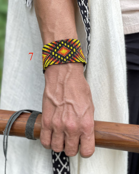 Handwoven bead loom bracelets with Ayahuasca-inspired tribal patterns, combining shamanic tools and talisman amulets for spiritual adornment