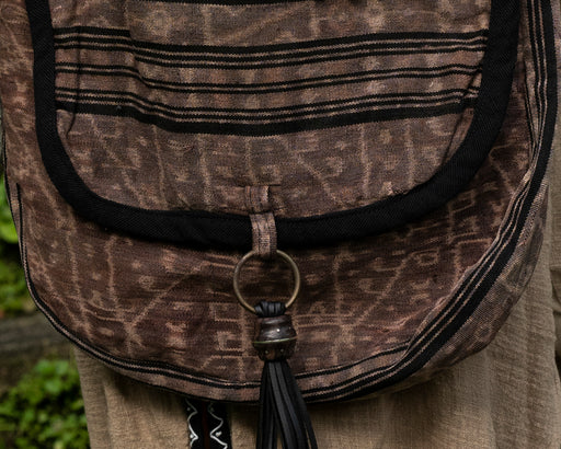 Compact ethnic shoulder bag with secure compartments for spiritual tools and personal items