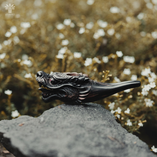 Artisan-quality black wood smoking pipe featuring a stunning dragon design, perfect for daily use.