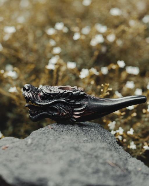 Artisan-quality black wood smoking pipe featuring a stunning dragon design, perfect for daily use.