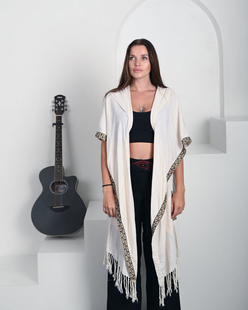 Artisan-crafted poncho in boho style, made from premium natural fabrics with intricate tribal patterns – perfect for spiritual practices and outdoor gatherings.