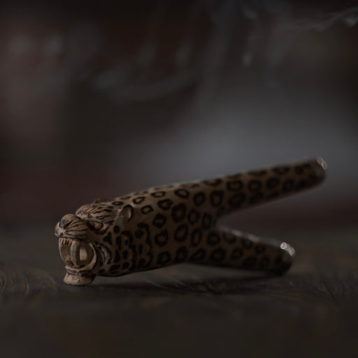 Handmade kuripe smoking pipe featuring a jaguar design, intended for use with Hape