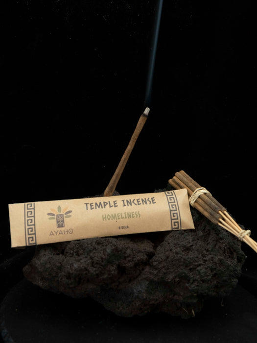 Incense sticks with a labeled package on a dark background