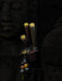 Wooden tool with gold accents on a dark textured background