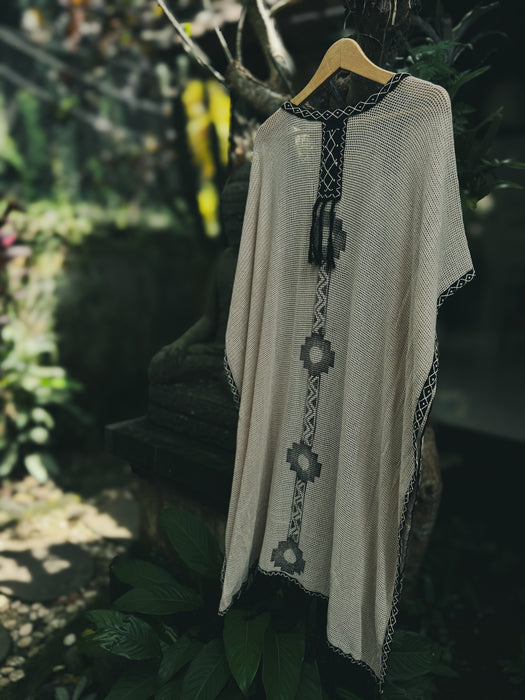 Ayaho unisex kimono poncho featuring sacred embroidery on soft natural cotton, reflecting slow fashion and nature-inspired design
