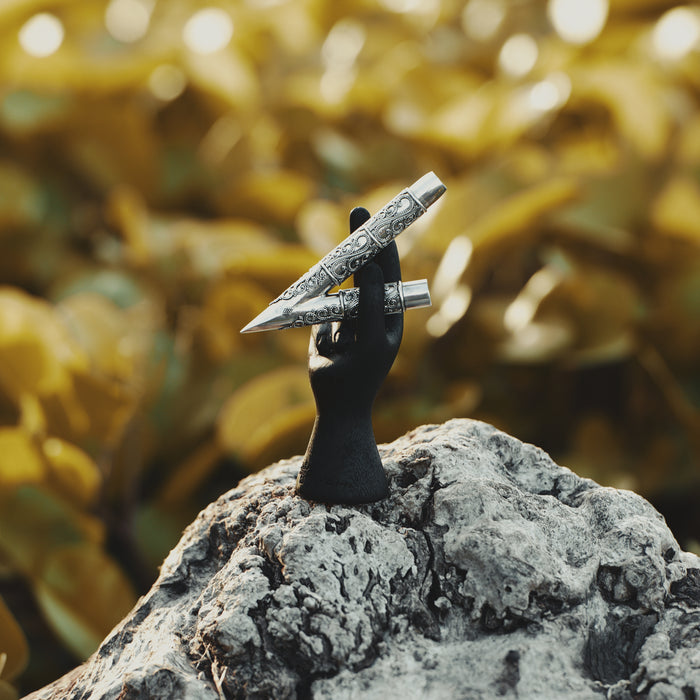 Ethnically patterned kuripe of silver