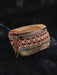 Artisan-crafted cotton belt bag featuring vibrant tribal designs, with multiple compartments and an adjustable strap for secure, stylish carry.