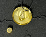 Gold pendant on a black background