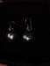 Pair of earrings on a dark background