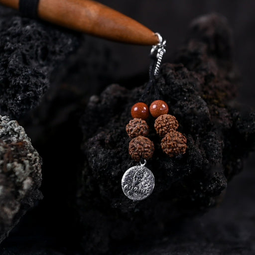 The kuripe, doubling as a necklace with detailed charms, represents both a shamanic tool and a unique gift.