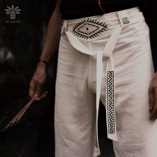 Detail of unisex boho organic cotton pants featuring a distinctive sacred geometry pattern on the belt, handcrafted for a blend of style and comfort in bohemian fashion. 