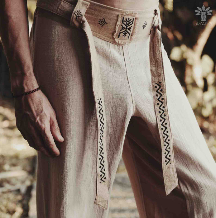 Handmade unisex bohemian wide-leg cotton pants with a belted waist and sacred geometry patterns, perfect for yoga enthusiasts seeking minimalist boho style