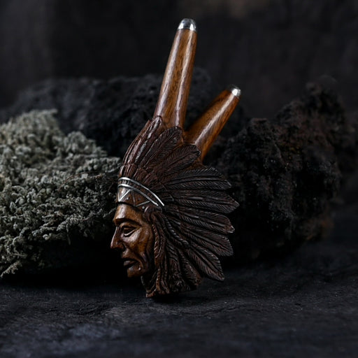 Exquisite handcrafted Rose Wood Kuripe with a detailed carving of an Indian face, an essential tool for rapéh ceremonies and a unique gift for enthusiasts of shamanic traditions