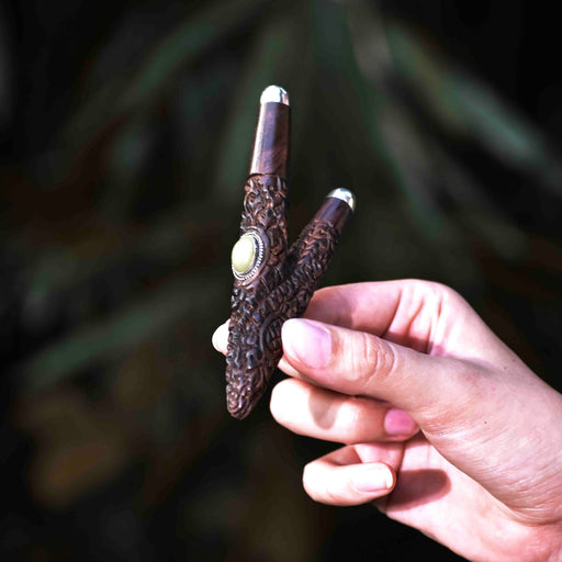 Experience the spiritual essence with this handmade Kuripe, showcasing Balinese design in rosewood with silver and Ye Ming Zhu stone—a shamanic snuff applicator for healing and meditation.