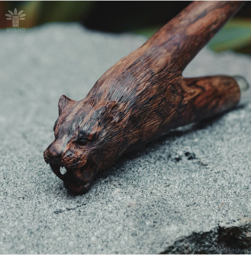 Mango wood kuripe pipe, exquisitely hand-carved with a bear totem, embodies traditional shamanic practices for hape snuff as a unique spiritual tool.