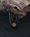 Bronze logo on Kuripe made from volcanic stone, adding sophistication.