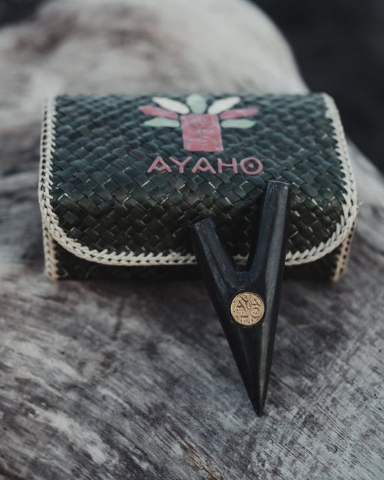 Nature's craftsmanship in Kuripe made from volcanic stone with a bronze logo, reflecting harmony and style.