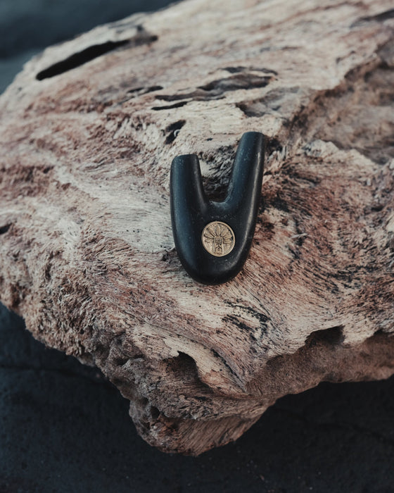 Perfect shape of Kuripe made from volcanic stone, harmoniously blending with natural elements.