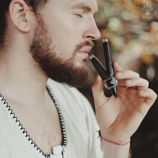 Bali-made wooden kuripe pipe with elegant silver tips and a black onyx stone, showcased as a unique, handcrafted hape snuff applicator and shamanic tool.