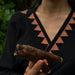 Mango wood smoking pipe with a bear totem, perfect for shamanic rituals.