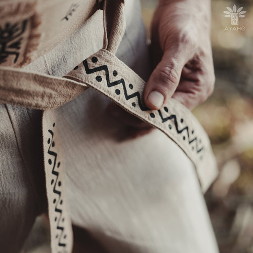 Handmade unisex bohemian wide-leg cotton pants with a belted waist and sacred geometry patterns, perfect for yoga enthusiasts seeking minimalist boho style