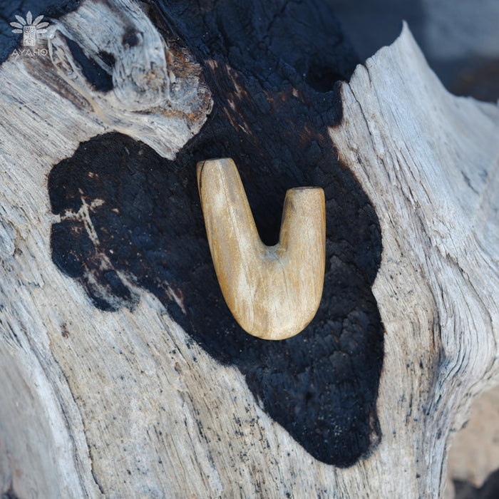 Artisan craftsmanship evident in the Kuripe pipe made from petrified wood, a true work of art.