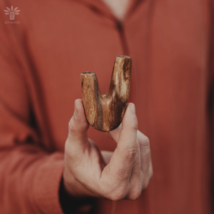 Artistic expression in the Kuripe pipe made from petrified wood, a blend of nature and art.