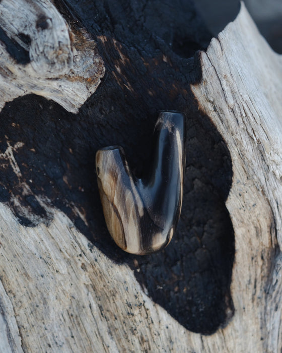 Earthy tones of the Kuripe pipe made from petrified wood, creating a warm aesthetic