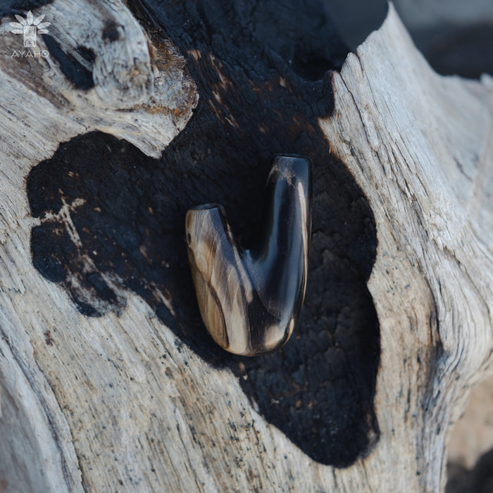 Earthy tones of the Kuripe pipe made from petrified wood, creating a warm aesthetic