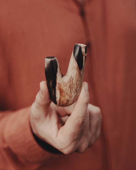 Earthy vibes of the Kuripe pipe made from petrified wood, perfect for a natural lifestyle.