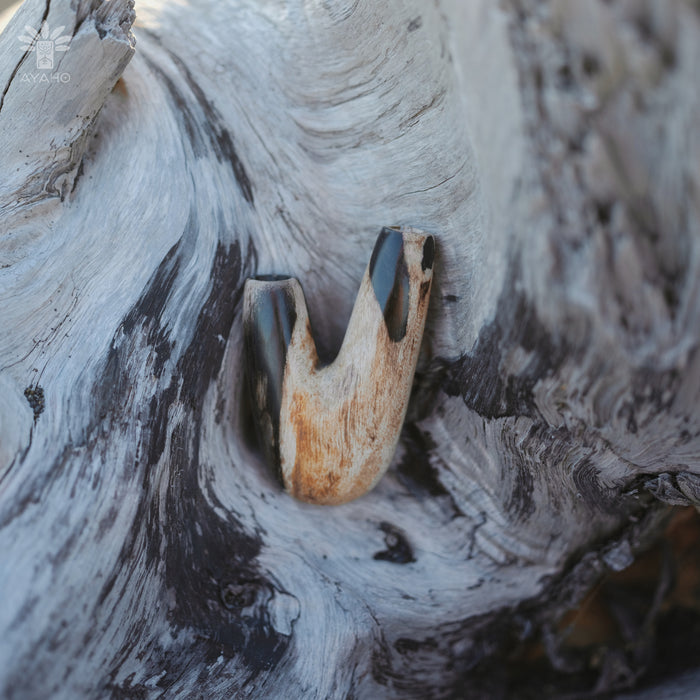 Handcrafted detail in the Kuripe pipe made from petrified wood, emphasizing quality.