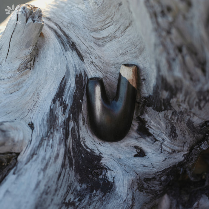 Natural variations in the Kuripe pipe made from petrified wood, each piece is unique.