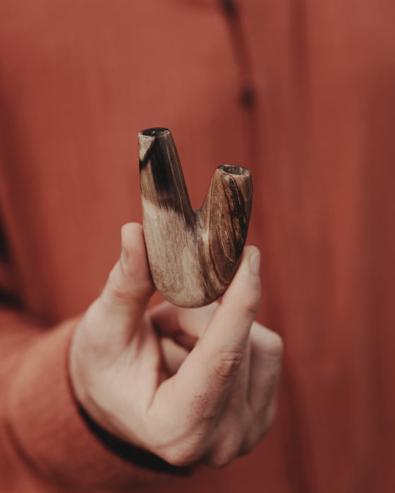 Nature's legacy in the Kuripe pipe crafted from petrified wood, a piece of history.