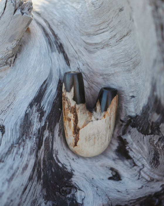  Rustic charm of the Kuripe pipe crafted from petrified wood, perfect for nature lovers.