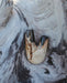  Rustic charm of the Kuripe pipe crafted from petrified wood, perfect for nature lovers.