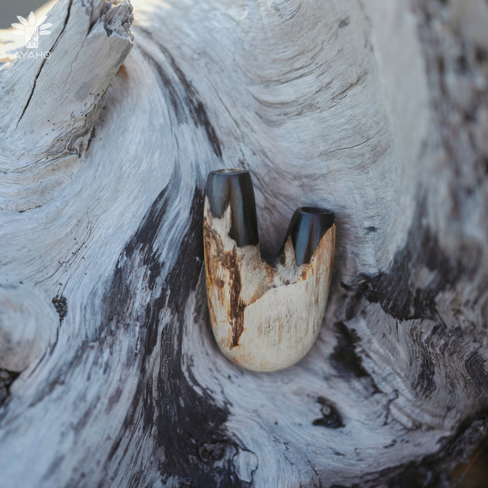  Rustic charm of the Kuripe pipe crafted from petrified wood, perfect for nature lovers.