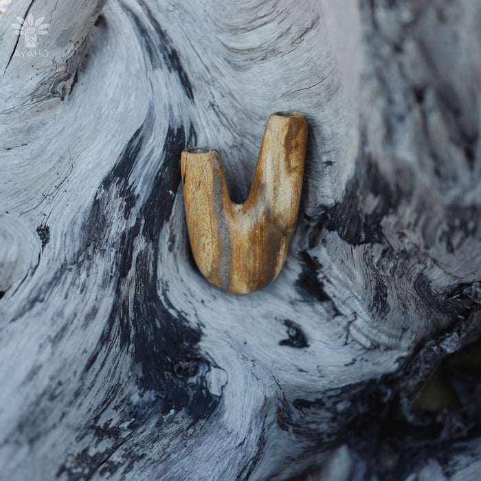 Subtle elegance of the Kuripe pipe crafted from petrified wood, perfect for any setting.