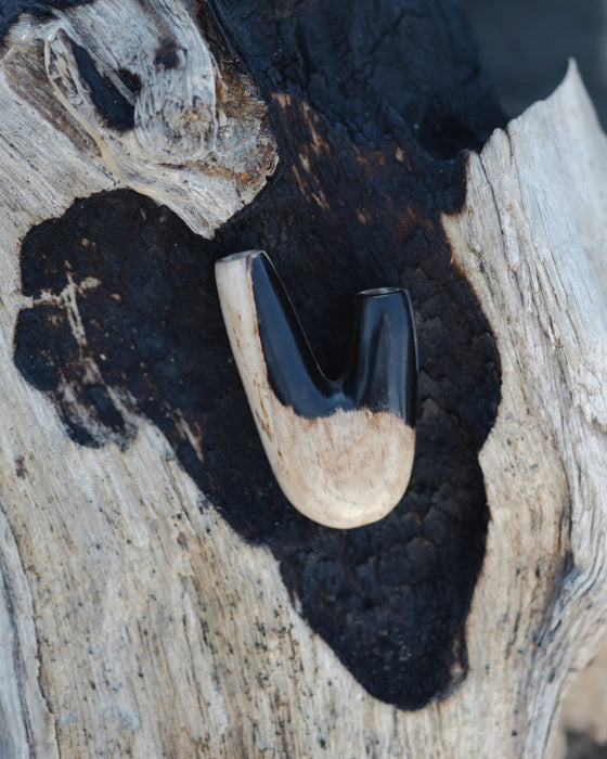 Timeless design of the Kuripe pipe crafted from petrified wood, a blend of art and nature.