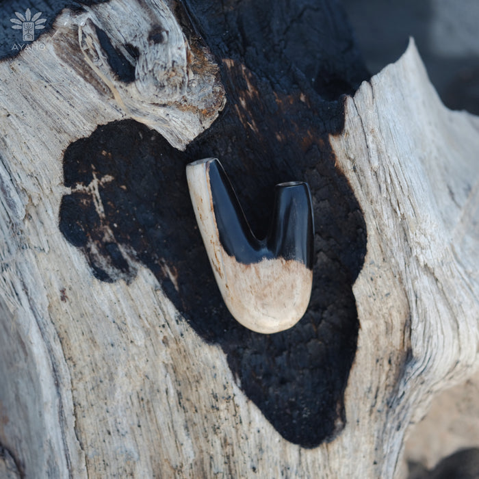 Timeless design of the Kuripe pipe crafted from petrified wood, a blend of art and nature.