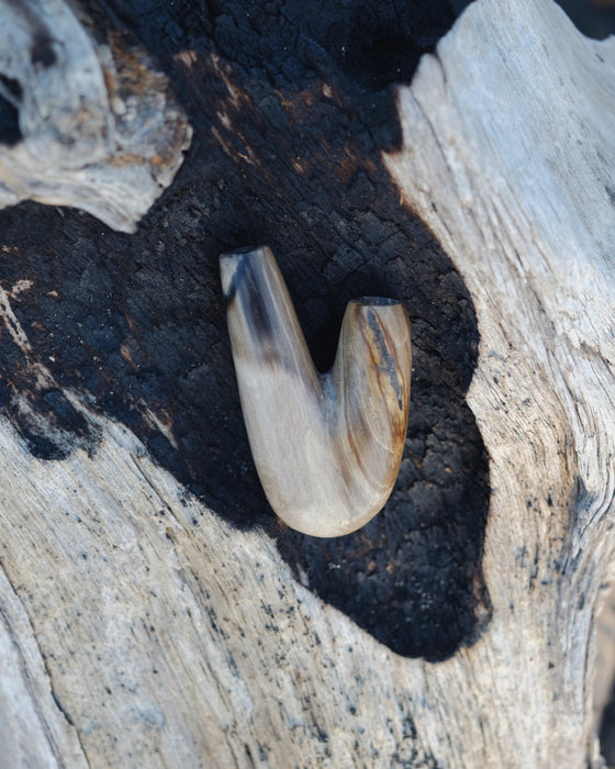 Warm hues of the Kuripe pipe made from petrified wood, inviting and comforting.