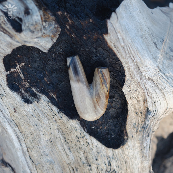 Warm hues of the Kuripe pipe made from petrified wood, inviting and comforting.