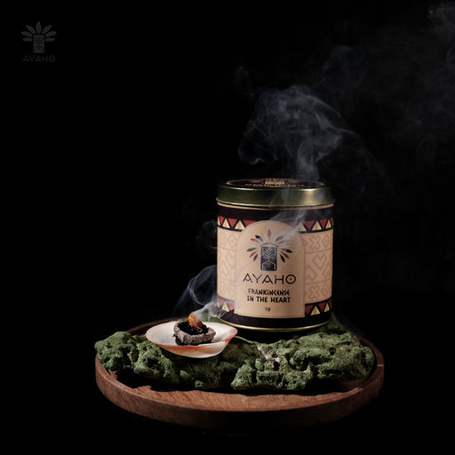 Hand-harvested frankincense tears burning on charcoal, releasing sacred smoke for energy purification rituals