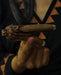 Detailed view of a bear-shaped kuripe's mouthpiece, highlighting the smooth polished wood and symbolic carvings.