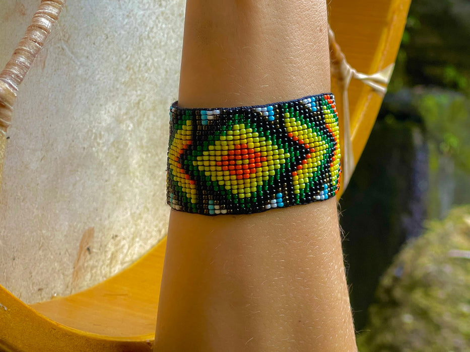 Handwoven bead loom bracelets with Ayahuasca-inspired tribal patterns, combining shamanic tools and talisman amulets for spiritual adornment