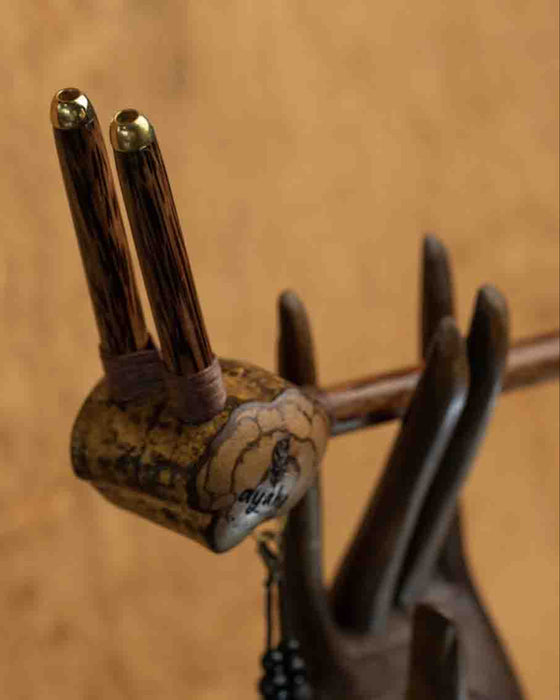 This Tepi pipe, handcrafted with sacred geometry and Peruvian ayahuasca inspiration, offers a profound spiritual connection for ceremonial Rapéh. Ideal for meditation, its a powerful symbol of healing and protection, and a unique gift for those