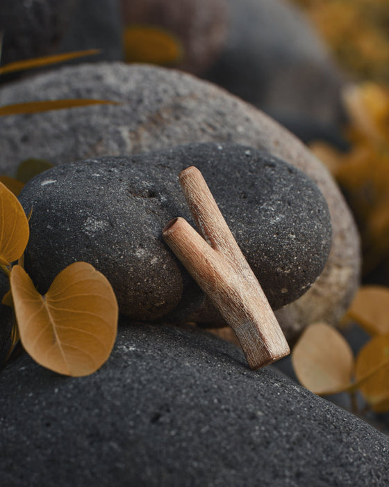 Artistic view of the teakwood kuripe, showcasing its unique design and natural beauty