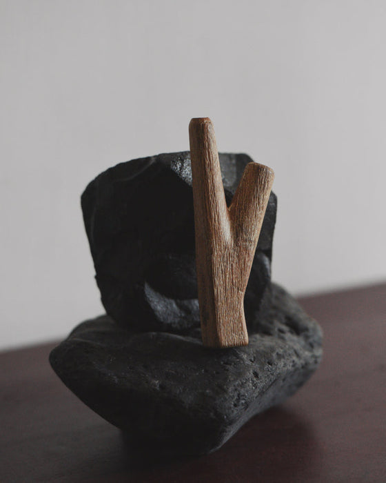 Teakwood kuripe used in a traditional setting, reflecting its cultural significance in shamanic practices.