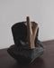 Teakwood kuripe used in a traditional setting, reflecting its cultural significance in shamanic practices.